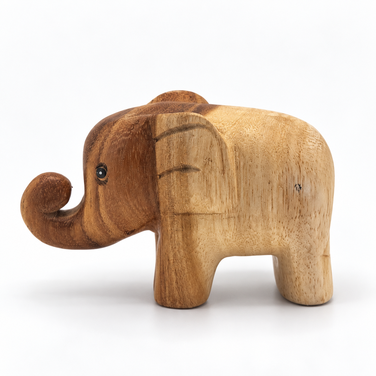 Curled-trunk wooden elephant — example A, side left