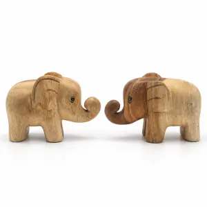 Two curled-trunk wooden elephants