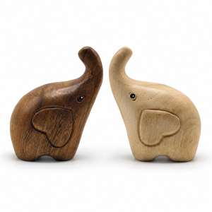 Two raised-trunk wooden elephants